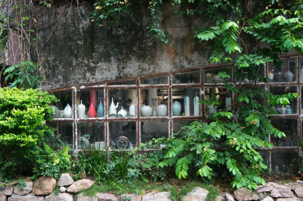 Jugs in shopwindow in Dafen Oil Painting Village in Shenzhen, China