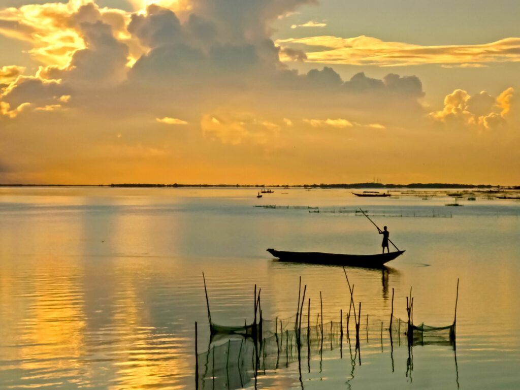 Beautiful sunrise of the Chilika Lake in orange color at Odisha state in  India