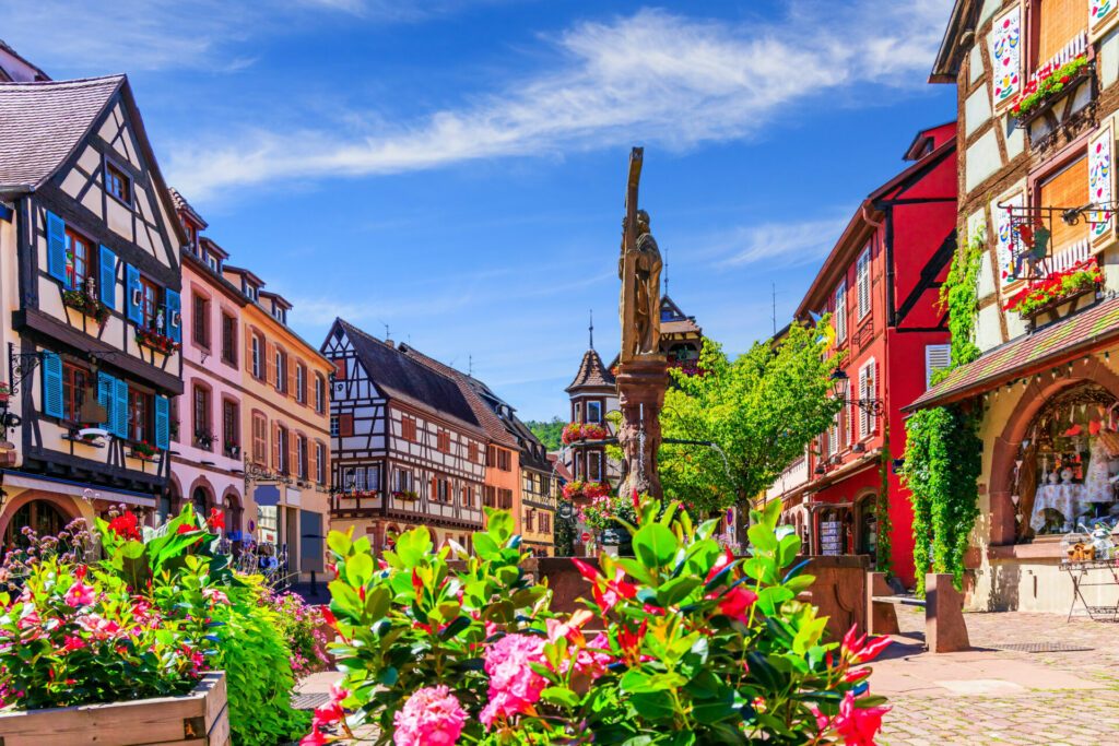 Kaysersberg Vignoble, France. Picturesque street with traditional half timbered houses on the Alsace Wine Route.