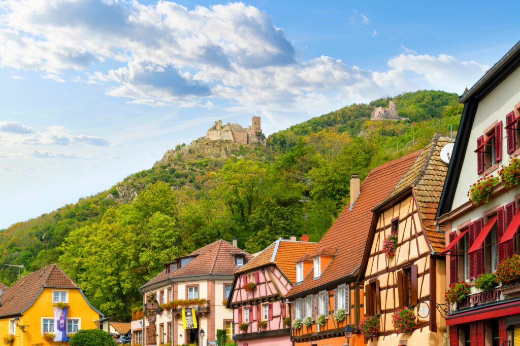 The Château de Saint-Ulrich hilltop castle rises above the medieval Alsatian town of Ribeauville, France.