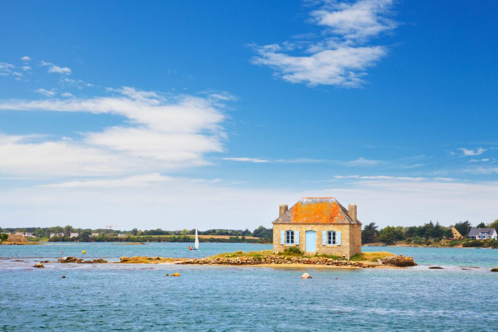 A small island with a cottage on it in the Etel River, Ile de Saint-Cado, Brittany, France.